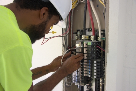 Electrician upgrading an electrical panel